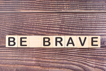 Wall Mural - BE BRAVE word made with wood building blocks