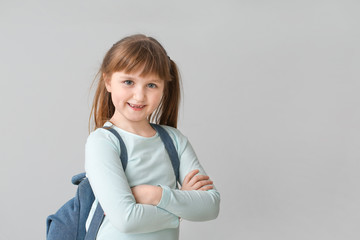 Sticker - Cute little schoolgirl on grey background