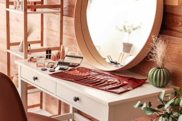 Sticker - Bag of professional makeup artist with brushes on table