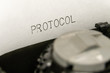 Close up printed text Protocol on an old typewriter