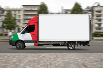 Italian delivery truck in motion on city street road.