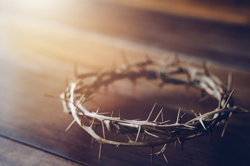 Poster - Close up of crown of thorns of Jesus on wooden table can be used for Christian concept , Easter concept with copy space