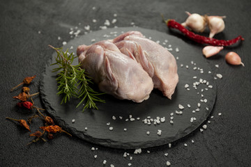 Raw quail meat on kitchen, cooking gourmet bird. Healthy diet recipe.