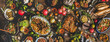 Flat-lay of Turkish traditional foods sush as lamb chops, quince, green beans, vegetable salad, babaganush, rice pilav, pumpkin dessert, lemonade over rustic table, top view, wide composition
