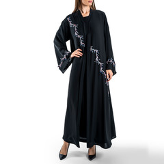 Wall Mural - Arabic Muslim woman in a stylish abaya, in white background - Image
