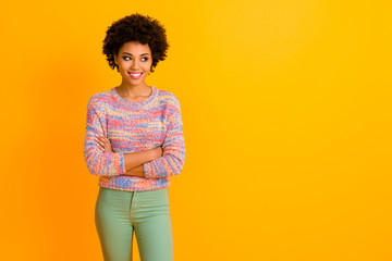 Poster - Portrait of attractive modern afro american girl cross hands listen her job friend look copy space wear stylish green trousers isolated over shine color background