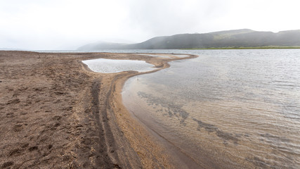 Poster - Tolmachev lake in overcast weather, large freshwater lake in the east of Kamchatka Peninsula, Russia