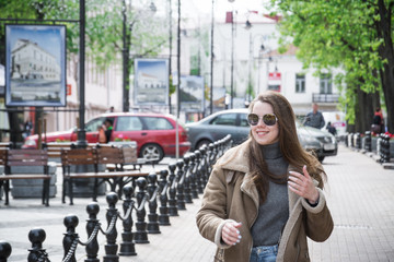 Young beautiful girl in stylish elegant clothes walking