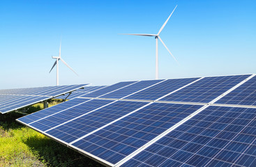 Wall Mural - rows array of polycrystalline silicon solar panels and wind turbines generating electricity in hybri