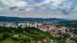 Aerial view of downtown Tuzla at sunset, Bosnia. City photographed by drone, traffic and objects , landscape.city photographed from air by drone.Old balkan buildings and communism type of architecture