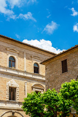 Wall Mural - Beautiful old architecture exterior high section partial view in Piazza Vittorio Emanuele, the town hall of Cingoli or Palazzo Comunale to the left , in Marche Region, Province of Macerata, Italy