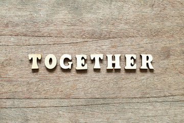 Wall Mural - Letter block in word together on wood background