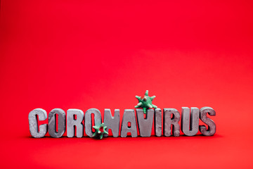 inscription from the letters 3D coronavirus covid 19 on a red background in isolation pandemic virus