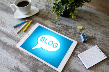 Wall Mural - tablet with blog text the on screen. social network, communication and internet marketing concept.