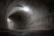 Dark Tunnel Round Shape Faintly Enlightened With Light Bulbs.