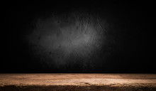 Selected Focus Empty Brown Wooden Table And Wall Texture Or Old Black Brick Wall Blur Background Image. For Your Photomontage Or Product Display