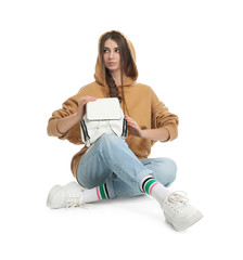 Poster - Beautiful young woman in casual outfit with stylish bag on white background