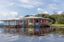 Floating House In The Amazon River