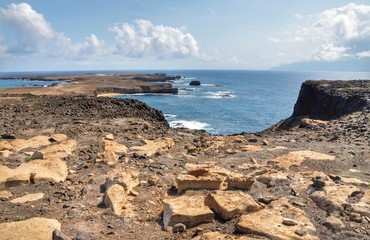 Wall Mural - Rocky flat volcanic landscape in Djeu, Cabo Verde