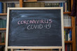 © Andrii - Outbreak Warning. written white chalk on blackboard in connection with epidemic of coronavirus worldwide.