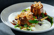 © Peter Karasev/ADDICTIVE STOCK - Closeup pieces of roasted meat with truffles and fresh herbs served on plate in cafe