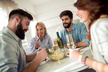 Poster - Friends having lunch together at home.