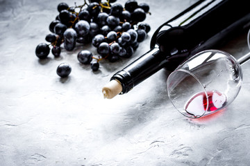 Glass of red wine and bottle on white background