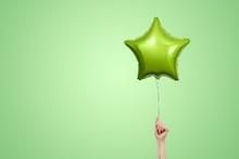 Light Green Birthday Balloons With Copy Space For Text. Star Shaped Balloon Isolated On Green Bright Background.  Festive Background For Party. Stylish Birthday Party Or Holidays Decorated Balloon