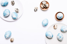 Stylish Eggs With Ombre Blue Marble Stone Effect In Different Dishes On White Background