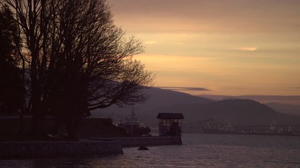 Wall Mural - Stanley Park Burrard Inlet Morning 4K UHD. Early morning Stanley Park joggers and Burrard Inlet traffic at dawn. 4K. UHD.