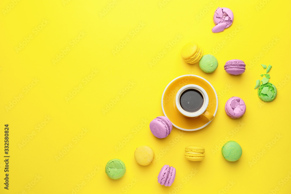 Tasty macarons with cup of coffee on color background