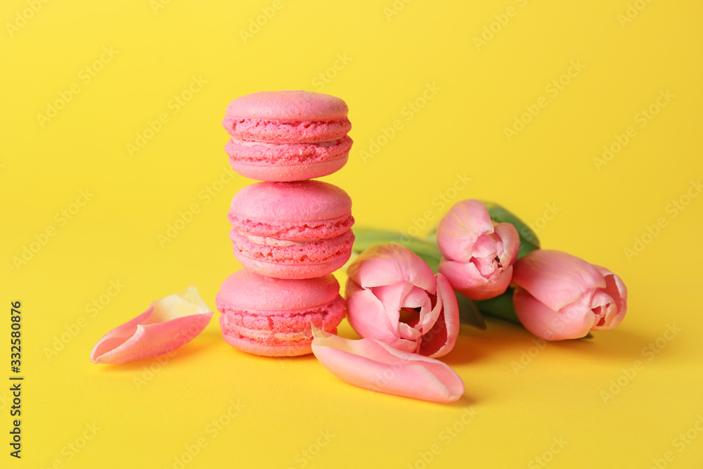 Tasty macarons on color background