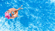 © Iuliia Sokolovska - Beautiful woman in hat in swimming pool aerial top view from above, young girl in bikini relaxes and swims on inflatable ring donut and has fun in water on family vacation, tropical holiday resort