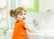 © Oksana Kuzmina - Cheerful kid washing hands and showing soapy palms