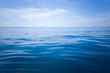 © satit - Calm Sea and Blue Sky Background.