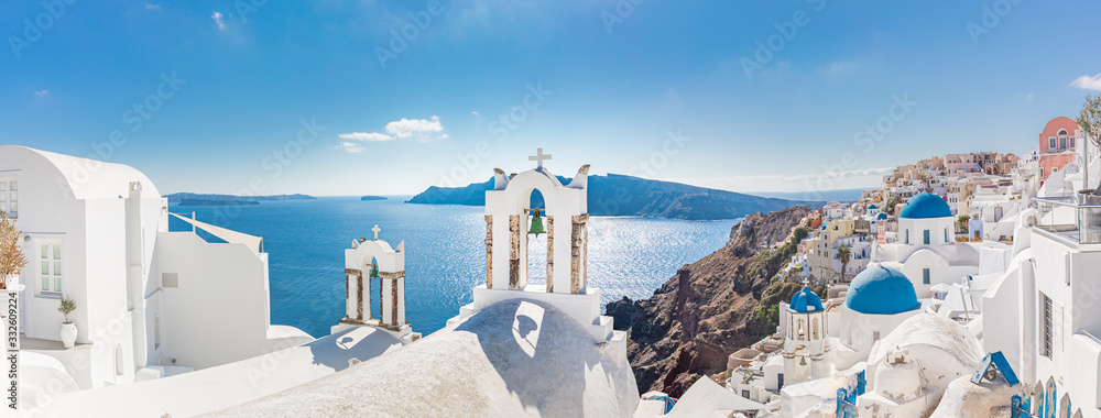 Amazing panoramic landscape, luxury travel vacation. Oia town on Santorini island, Greece. Traditional and famous houses and churches with blue domes over the Caldera, Aegean sea - obrazy, fototapety, plakaty 