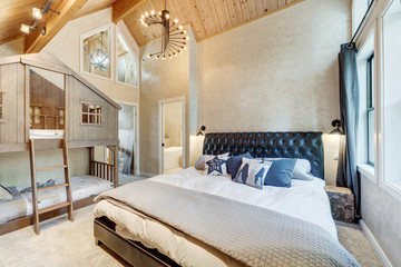 Wall Mural - Amazing bedroom design with hige vaulted wooden ceiling, large windows, modern chandelier, TV, king size bed and cozy bedding,  Barn style railing doors to the closet. 