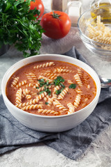 Wall Mural - Tomato soup with fusilli pasta in the bowl