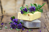 Fototapeta Lawenda - bars of natural soap and lavender flowers