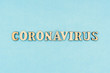 © Natalya Lys - Coronavirus, covid-19. The inscription coronavirus on a blue background. Self-isolation and quarantine, personal protective equipment, phonendoscope and stethoscope.