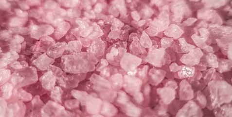 sea salt close up as illustration of relaxing aromatherapy spa and grainy pink texture background ba