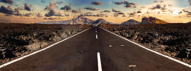 Image related to unexplored road journeys and adventures.Road through the scenic landscape to the destination in Lanzarote natural park