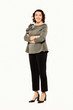 Full length of smiling attractive businesswoman while standing with arms crossed and looking at camera isolated over white background.