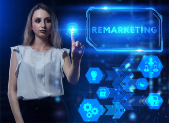 Business, Technology, Internet and network concept. Young businessman working on a virtual screen of the future and sees the inscription: Remarketing