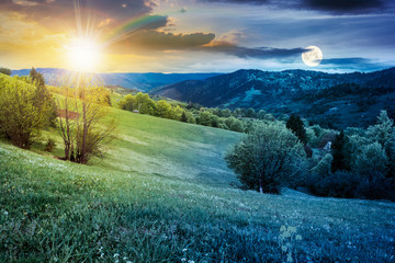 Wall Mural - time change above rural landscape in mountains. countryside scenery on an overcast weather in spring