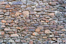 Stone Wall Texture. Example Of Ancient Masonry