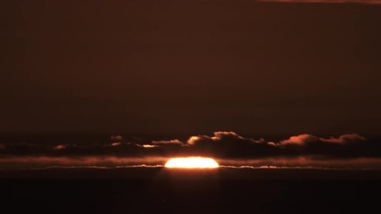 Wall Mural - Night To Day Sunrise Over Ocean And Cloud Horizon