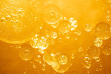 Fototapeta Łazienka - golden yellow bubble oil droplet, abstract background