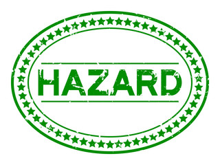 Sticker - Grunge green hazard word oval rubber seal stamp on white background