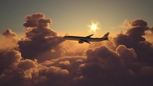 Airplane Flying Above The Clouds On Sunset